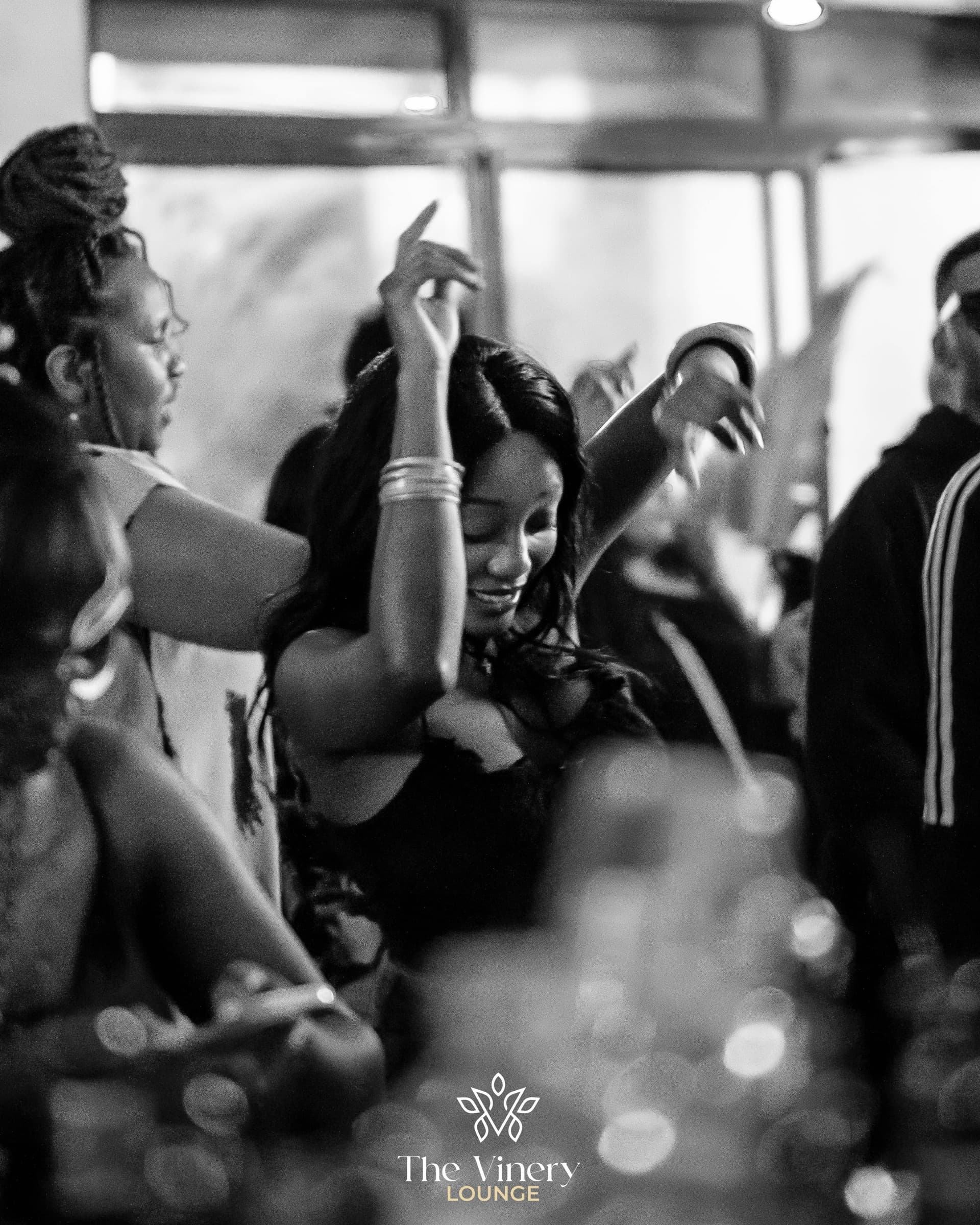 Guest dancing with her arms raised